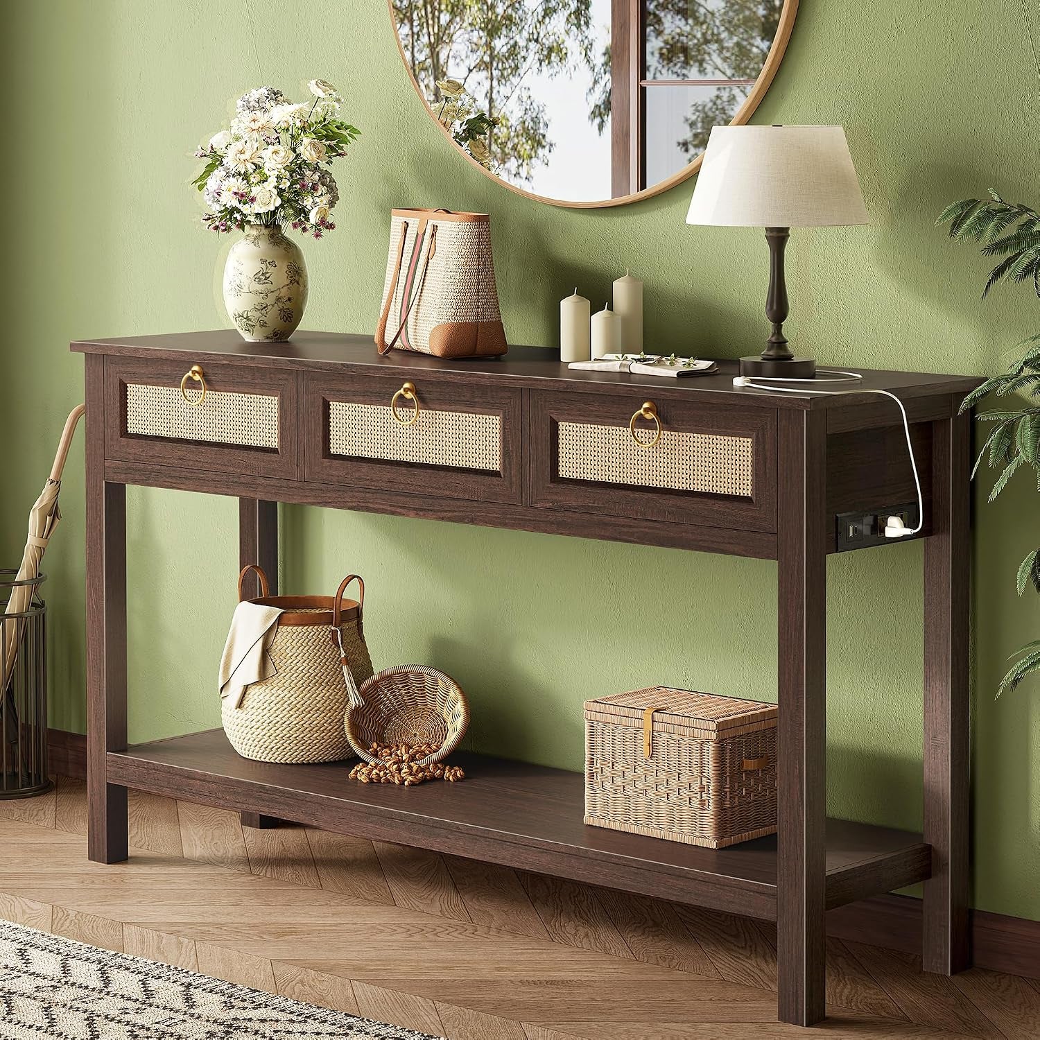 Dark brown console table angled slightly with woven baskets below and a lamp cord plugged into the side outlet