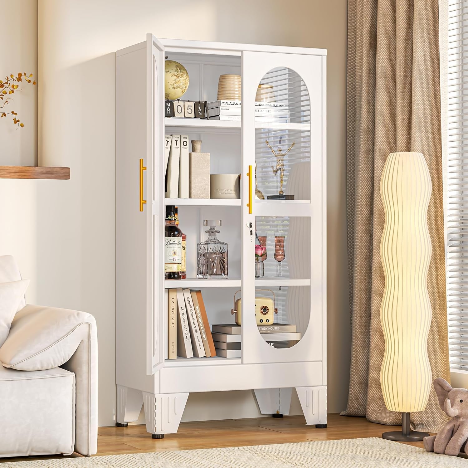 Single white display cabinet styled in a cozy corner next to a tall wavy floor lamp and draped curtains.