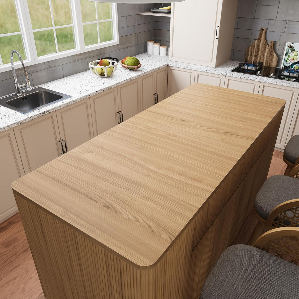 Close top-down view of the island’s rounded wood-grain countertop and fluted side panel with stools at the edge
