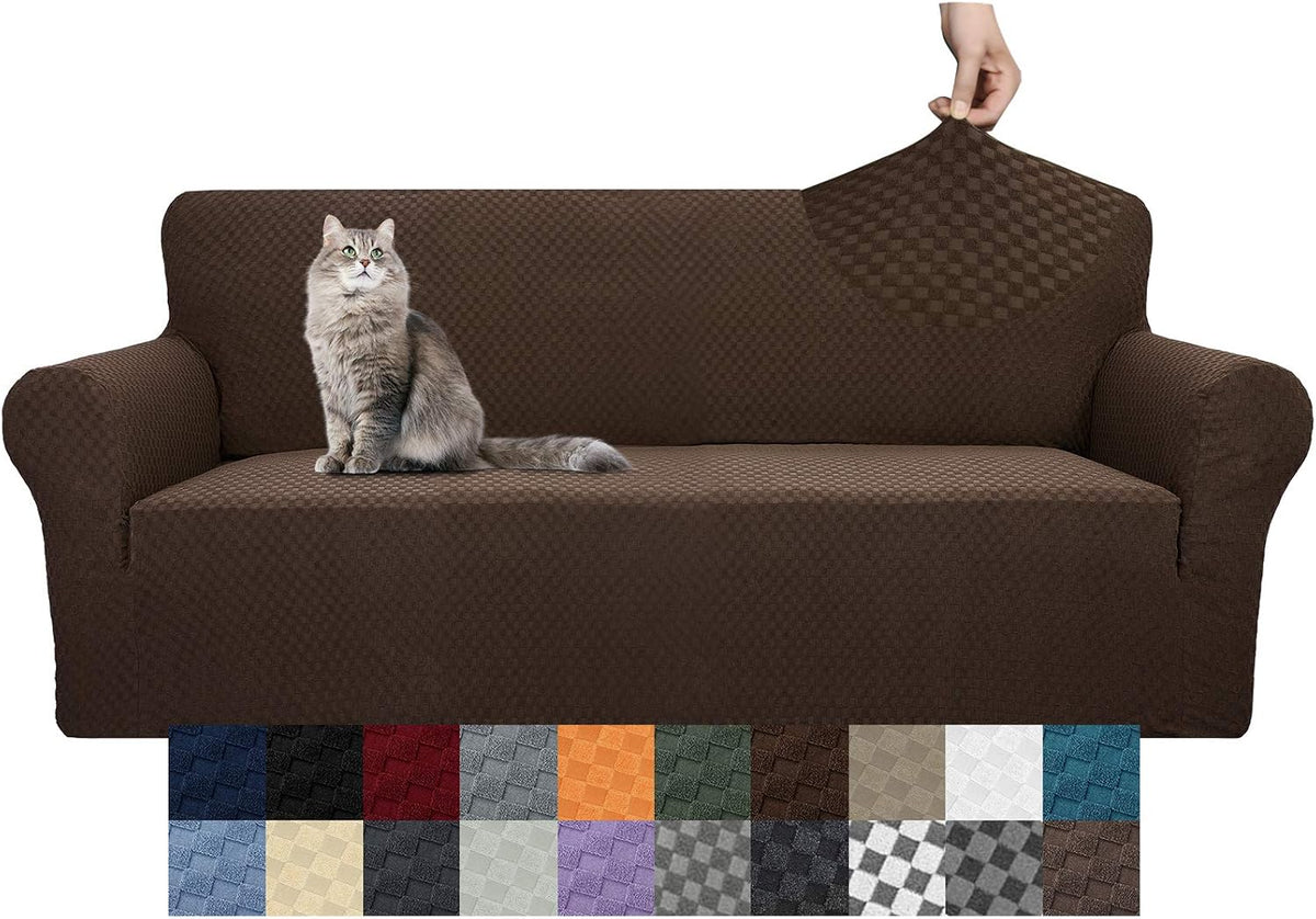 Three-seat sofa in a dark brown textured slipcover with a gray cat on the seat and a hand stretching the back fabric.