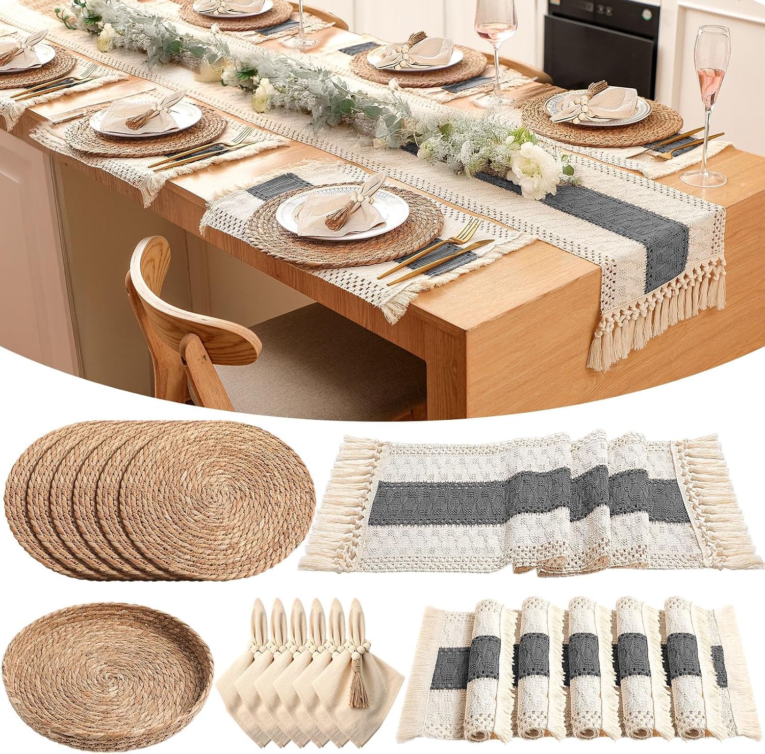 Long wooden table set with woven round placemats, fringed runner with dark center stripe and floral garland down middle.