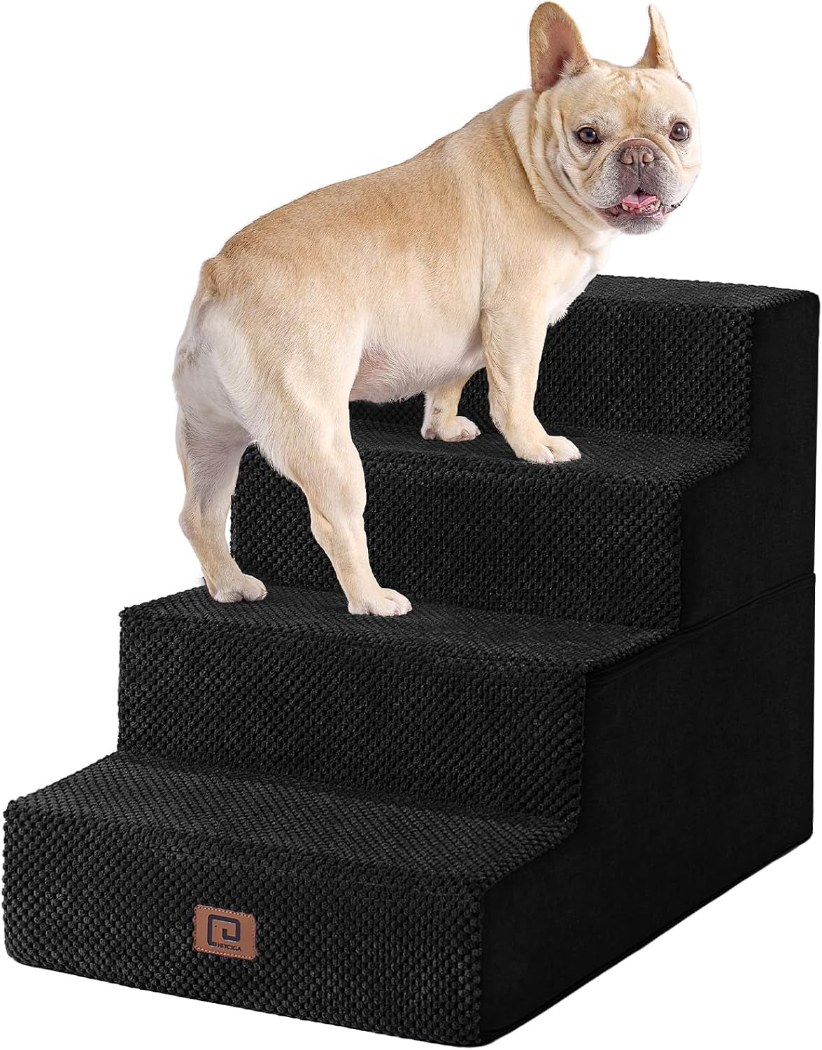 Small tan French bulldog standing on four-step black fabric pet stairs shown on white background