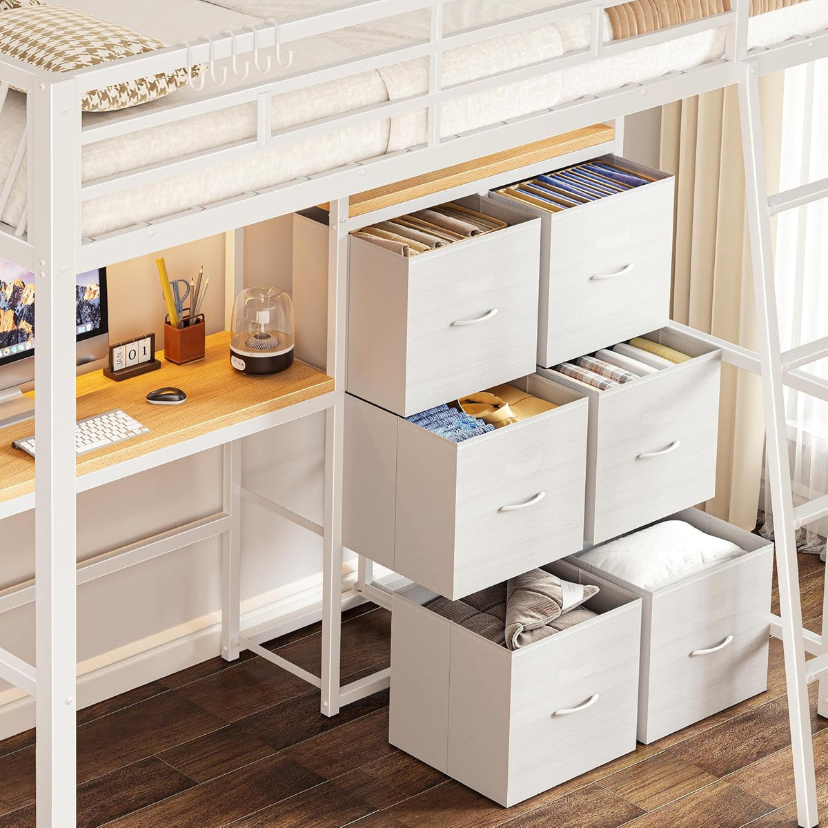 Close-up of six white cube-style drawers arranged under the loft bed beside a wood-toned desk top.
