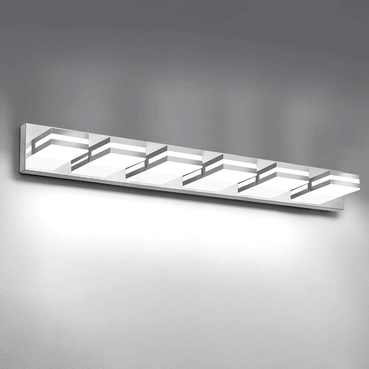 Front view of a long rectangular LED vanity light with six illuminated square diffusers on a silver backplate.