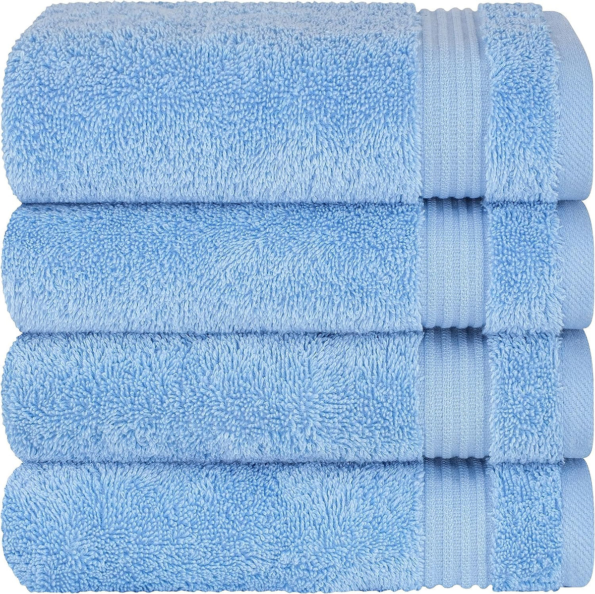 Three sky-blue towels stacked flat, highlighting dense pile and a textured border strip on each towel.
