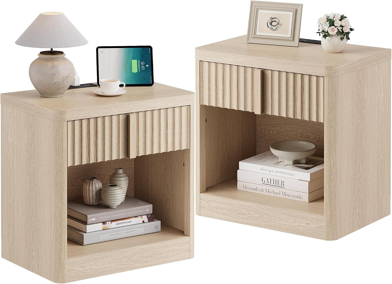 Two cube nightstands in light oak, each with a fluted top drawer and open lower shelf, styled with books and ceramics.