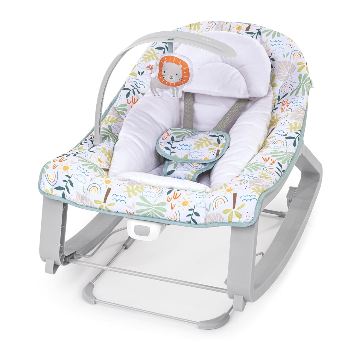 Three-quarter view of a colorful nature‑print baby bouncer with white cushion and a hanging lion toy.