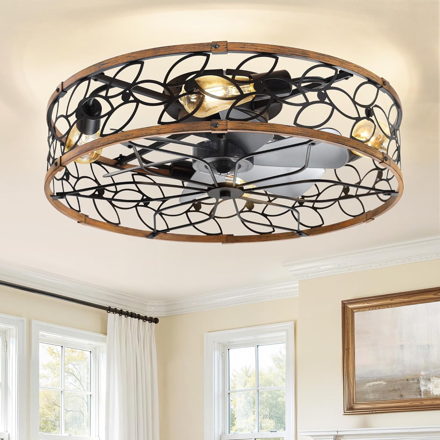 Angled underside view showing the fan blades, exposed bulbs and circular metal-and-wood decorative cage.