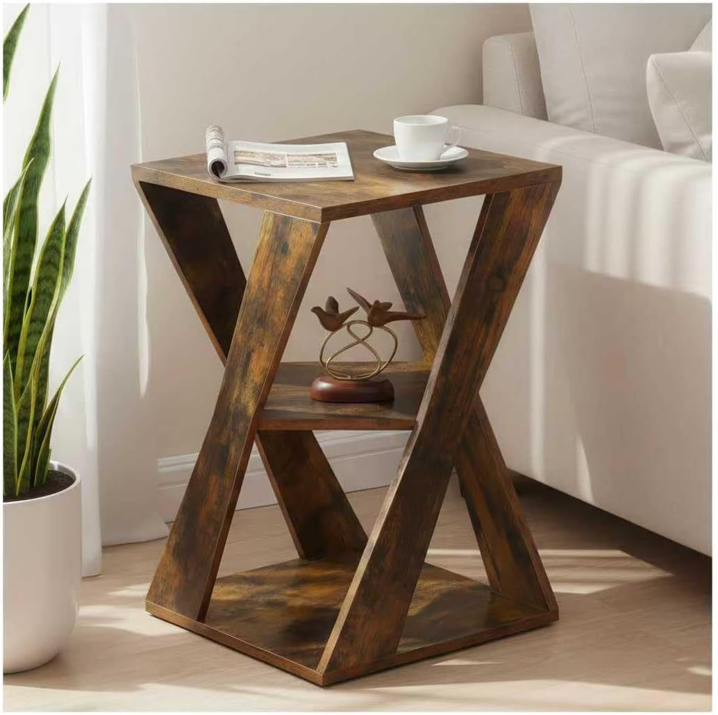 Rustic brown wooden X-shaped side table angled front view next to a sofa with decor on top