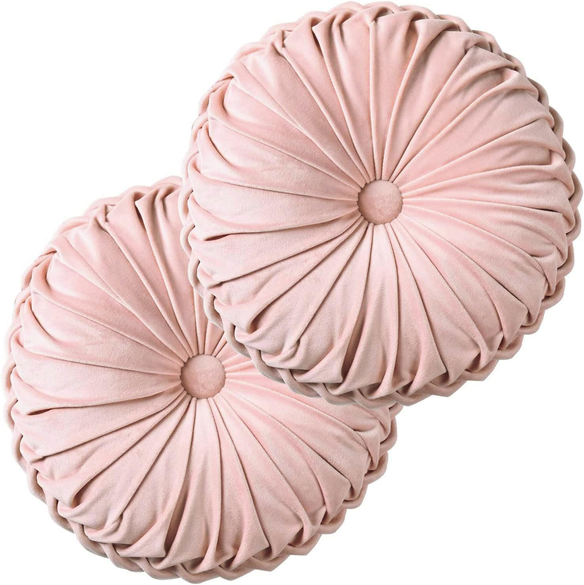 Close-up of two pink velvet ruched round pillows stacked against a white background showing pleated texture