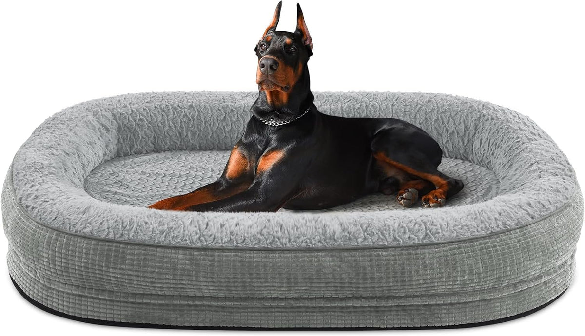 Gray oval bolster dog bed with a Doberman sitting alert inside