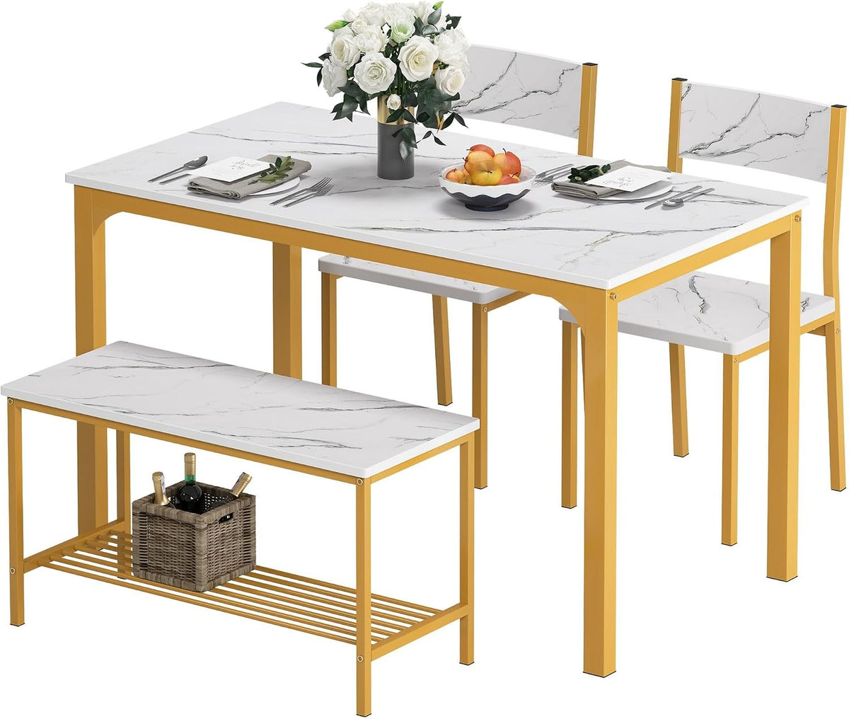 Three-quarter view from above showing white marble-look tops and gold metal frames, with bench and chairs; wicker basket on