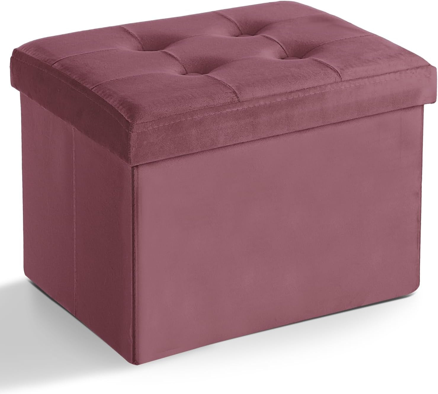 Mauve-pink fabric storage ottoman with padded, button-tufted lid shown from an angle.