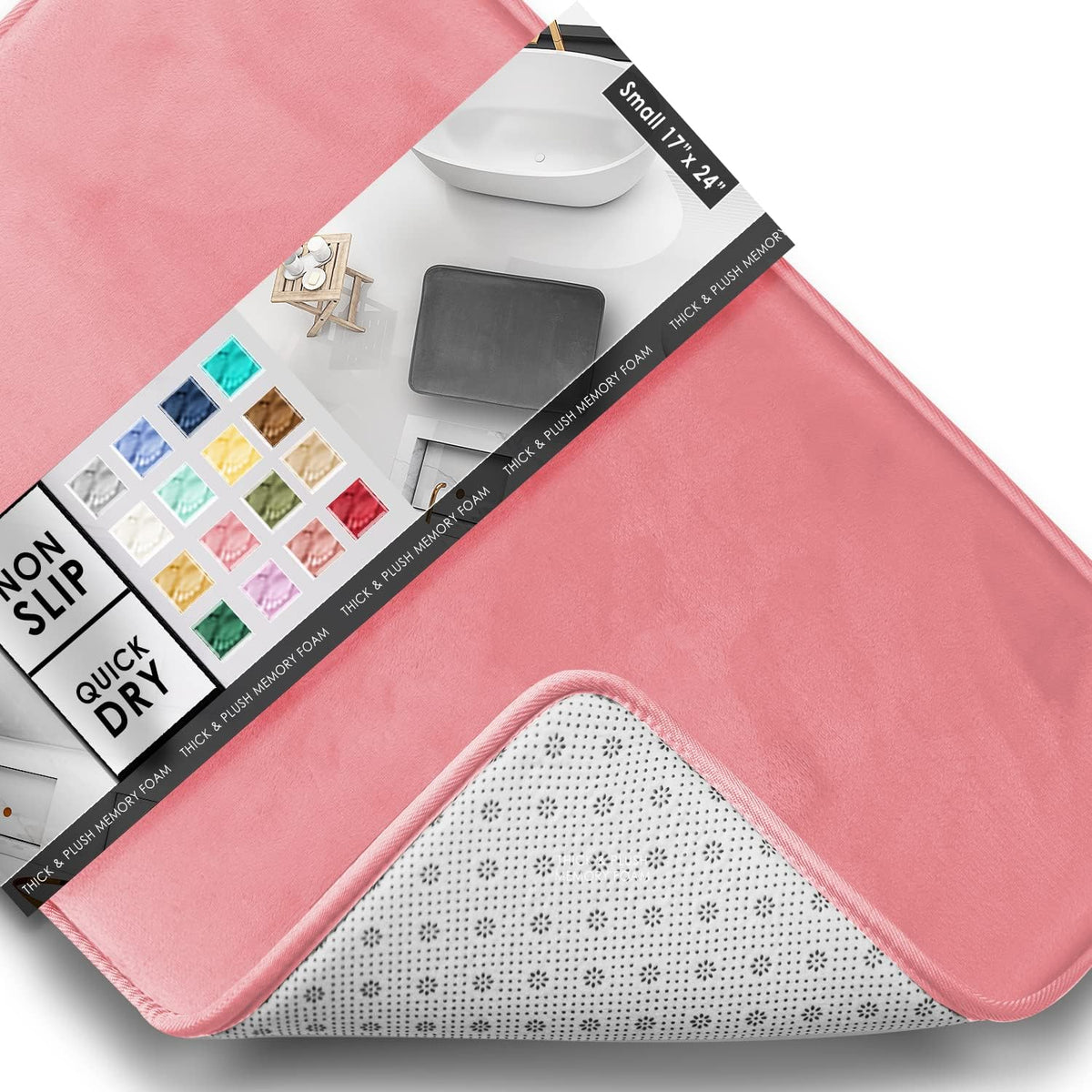 Close-up of a pink rectangular mat corner flipped to show white dotted non-slip underside and color swatch packaging.