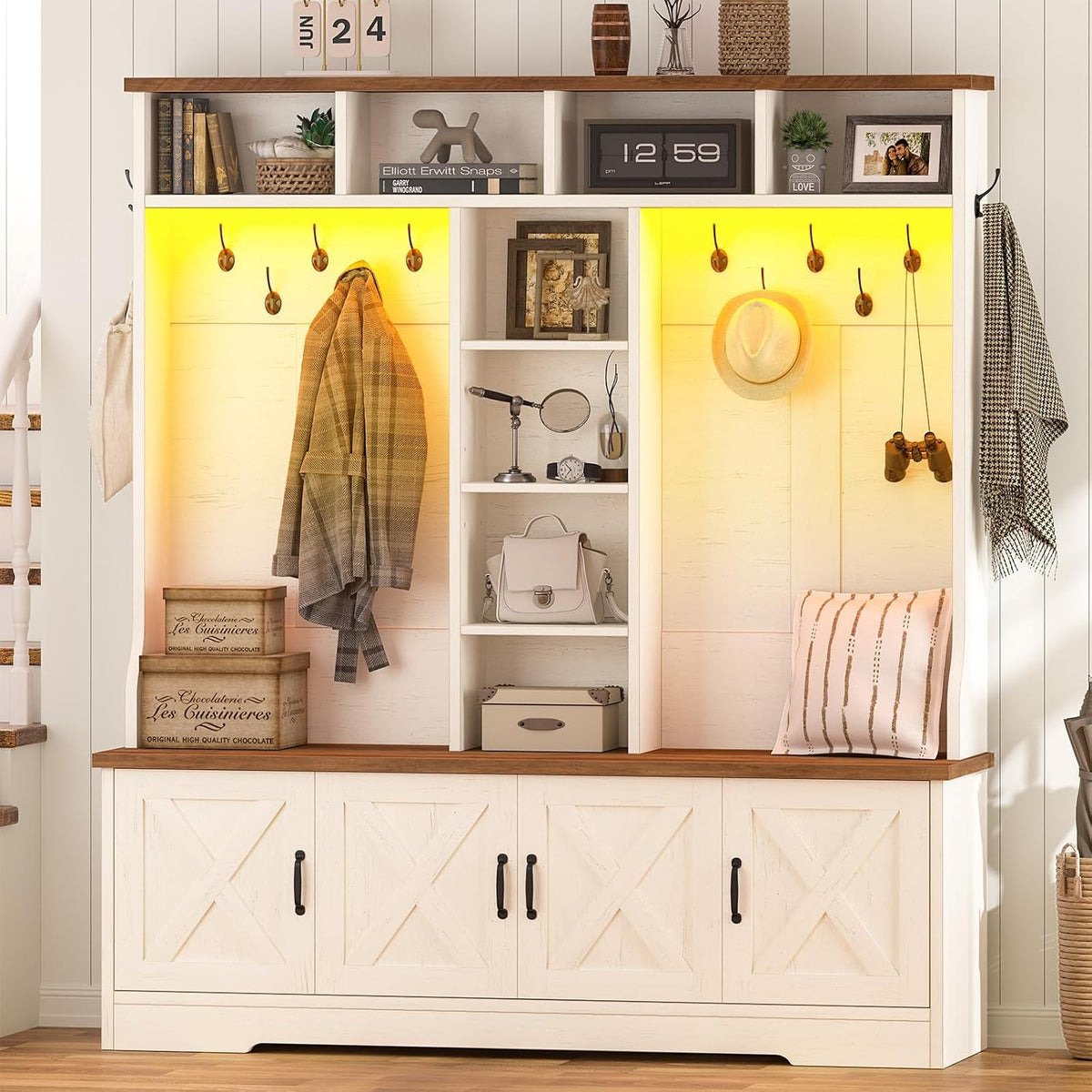 White hall tree with brown top, yellow LED-lit cubbies, hat, coat, binoculars and stacked storage boxes on the bench.