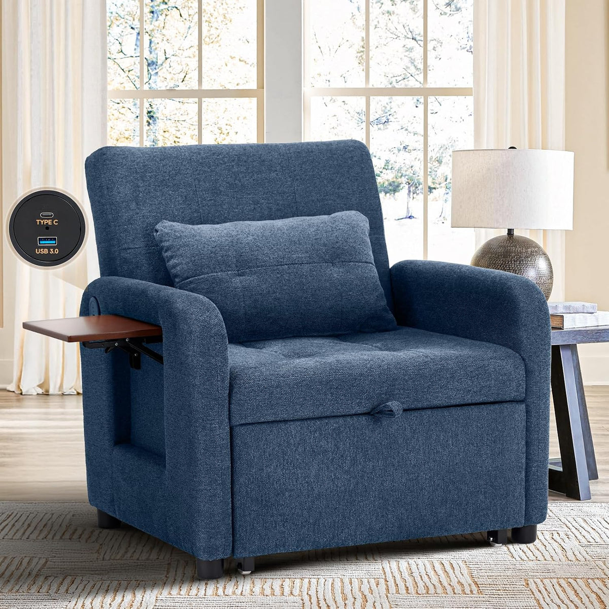Blue fabric chair set in a bright living room by a window, shown with a side table and lamp.