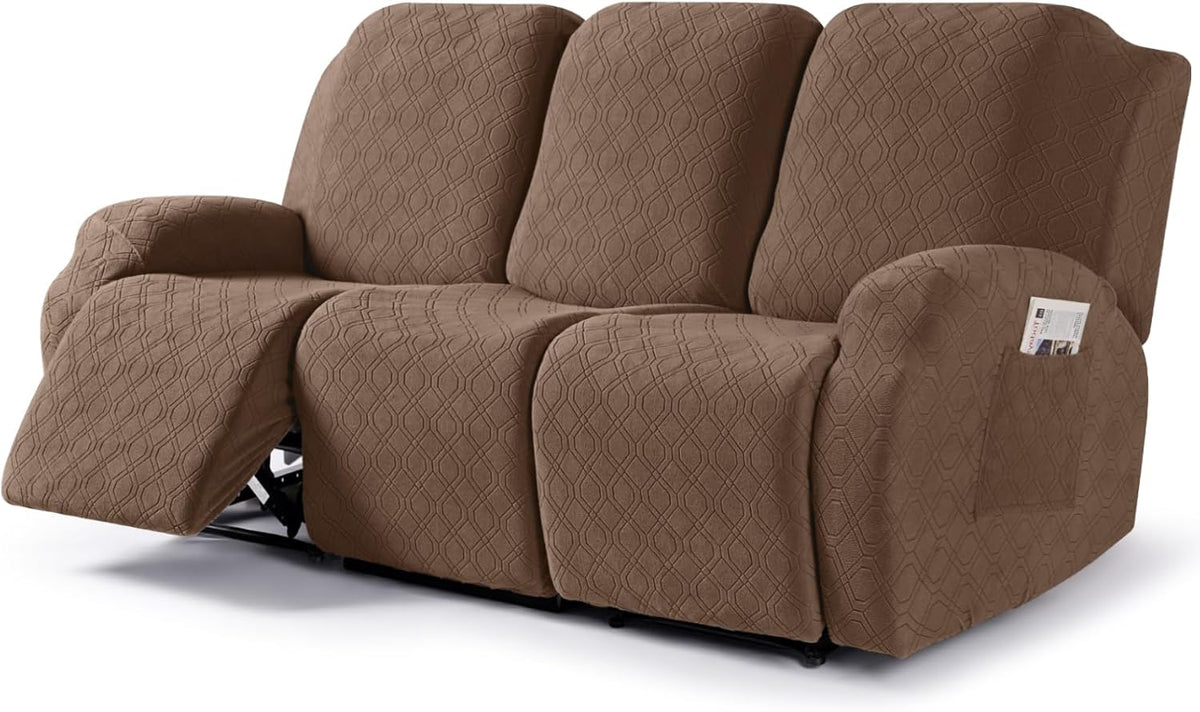 Brown three-seat reclining sofa with a fitted textured slipcover and one footrest extended.