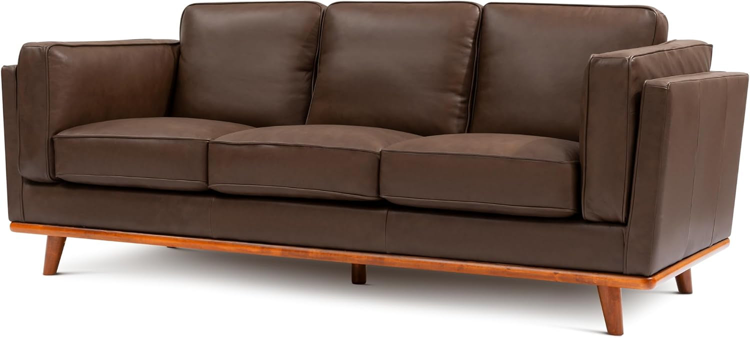 Three-seat chocolate leather sofa with wooden base and tapered legs shown at an angle.