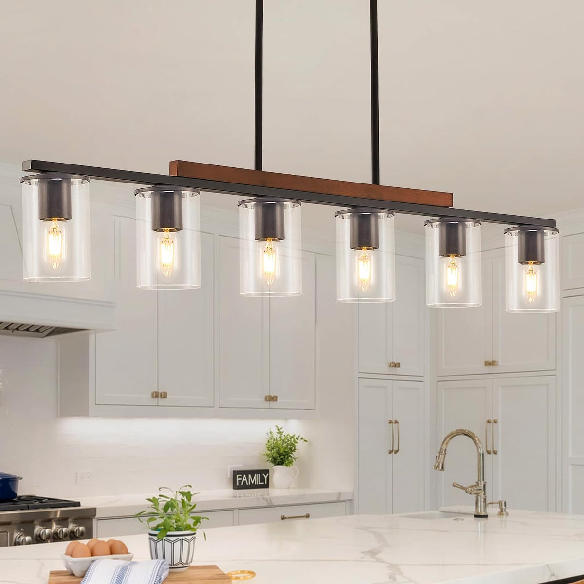 Frontal view of the six-light linear fixture showing six clear glass cylinders and exposed filament bulbs.