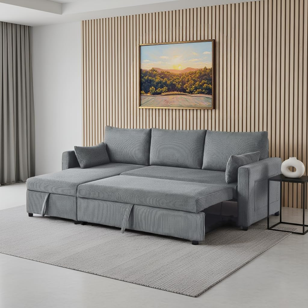 Gray corduroy sectional sleeper with chaise extended into a low bed in a living room.