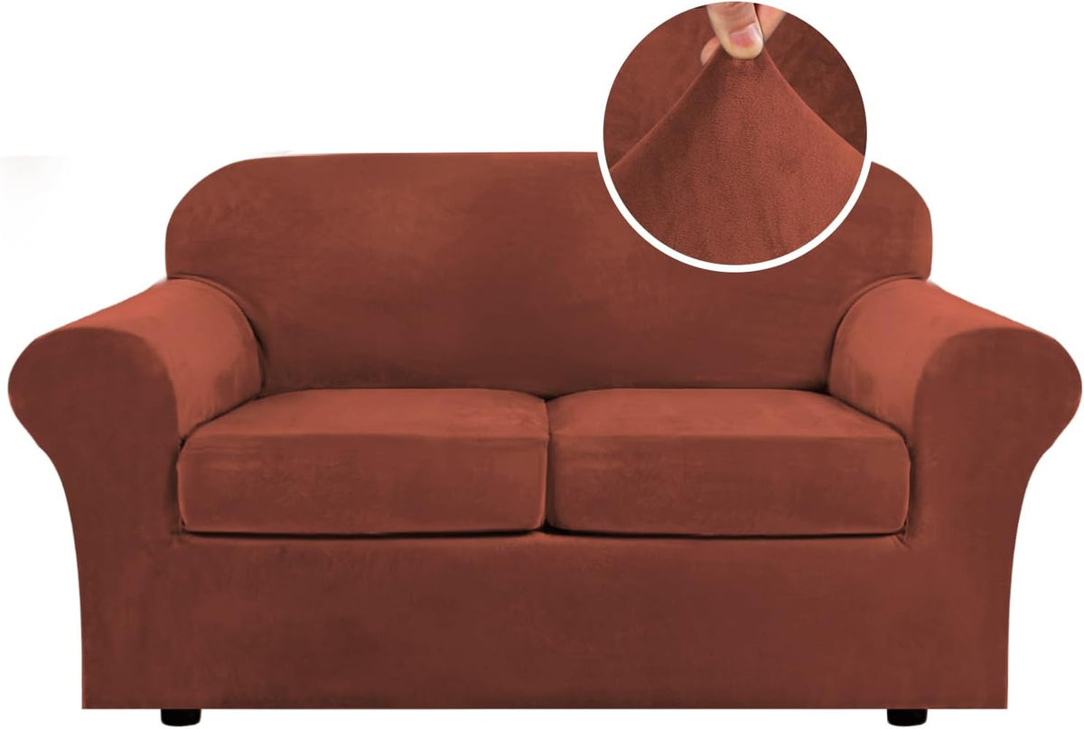 Front view of a two-seat loveseat in rich rust velvet with a round inset highlighting the plush fabric texture.