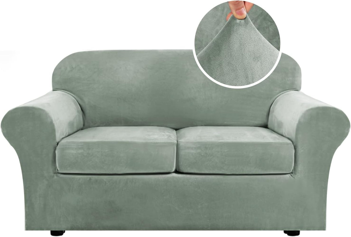 Front view of a two-seat sofa with rounded arms in light sage-green velvet cover and a circular fabric close-up.