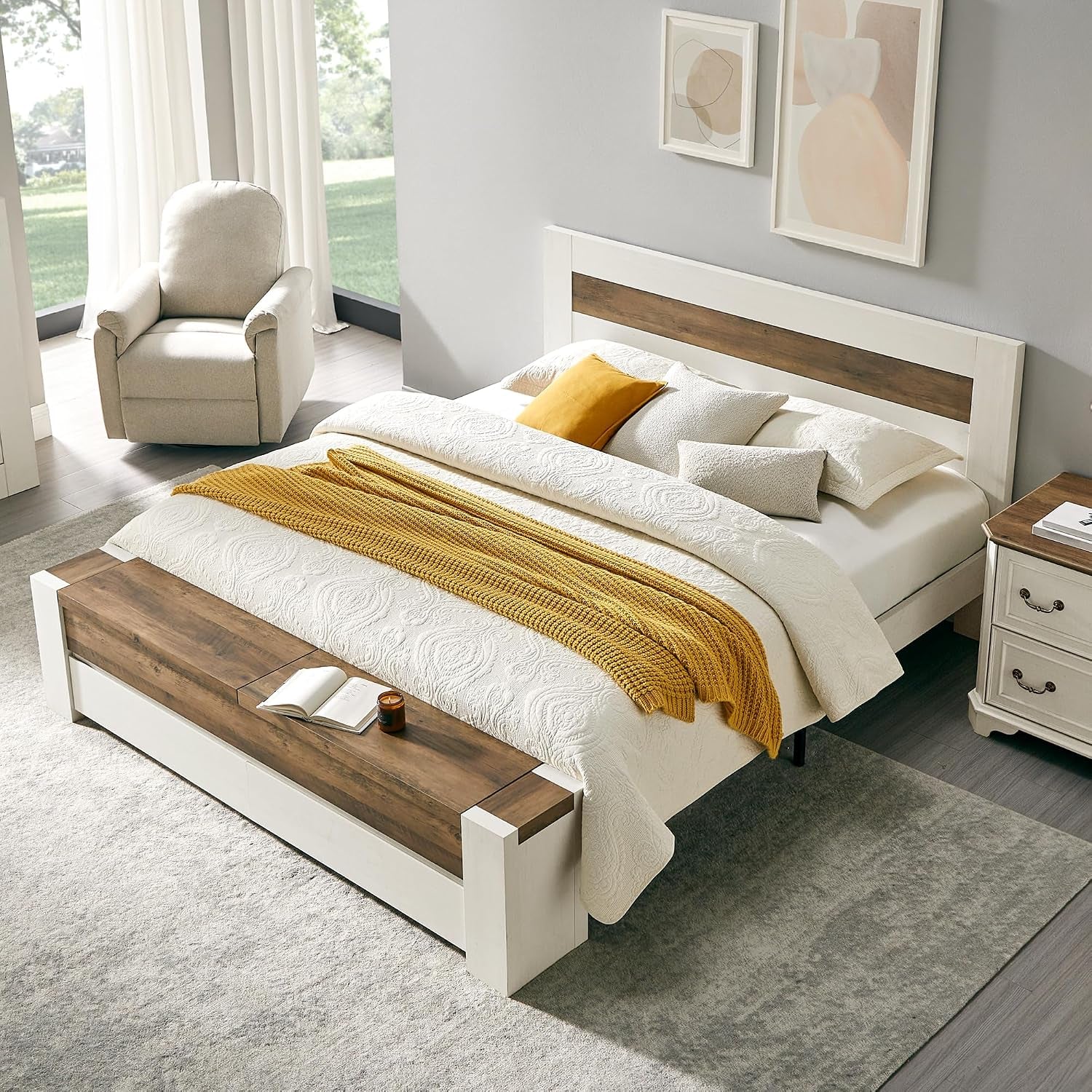 Angled view of the white-framed bed with wood inset headboard and matching wood-topped bench.
