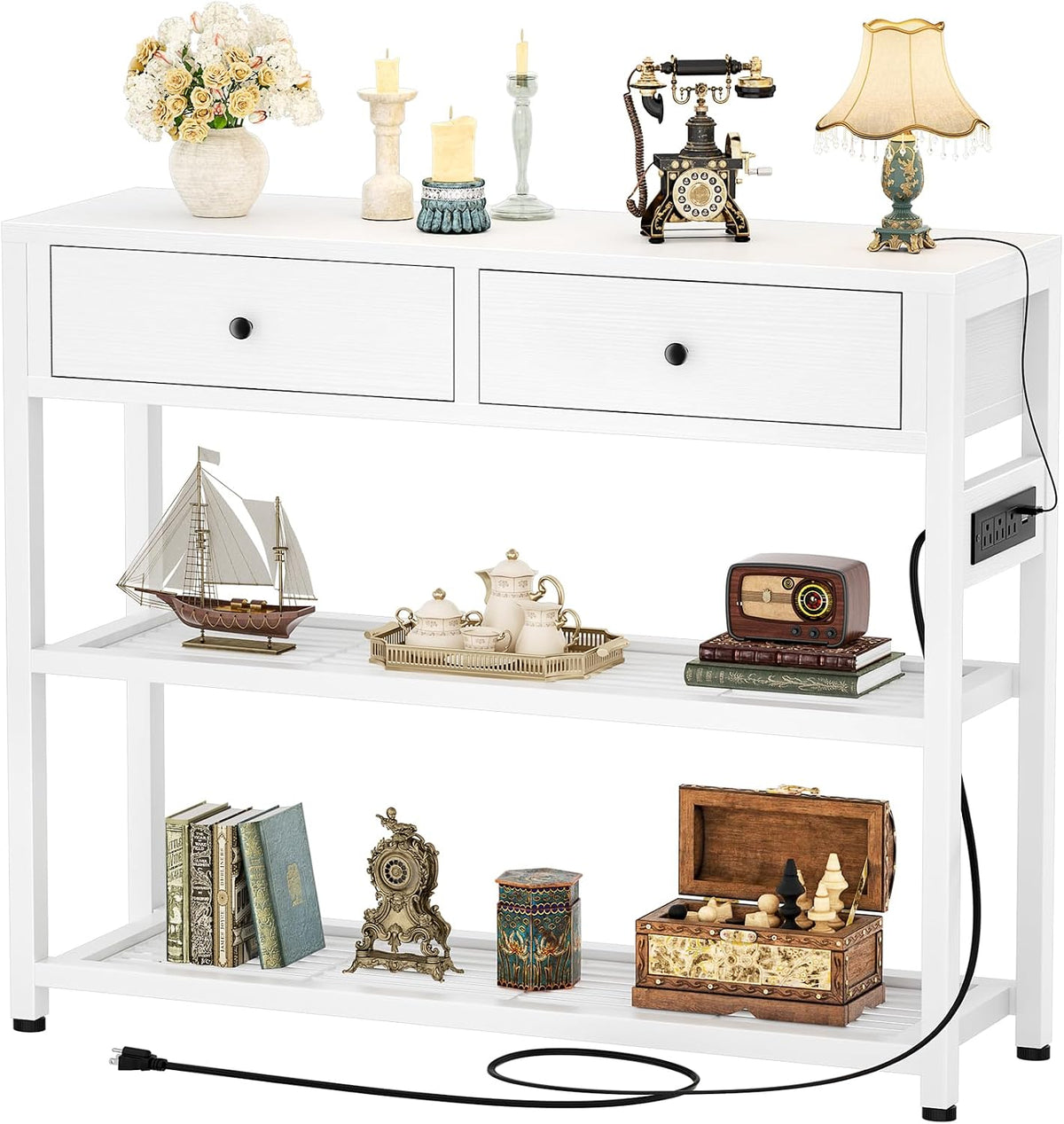 Console table in white finish shown straight-on with decorative objects on top and a visible side power outlet and cord.