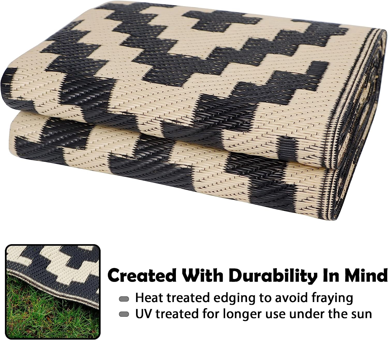 Folded rug stacked to show woven polypropylene texture and black-and-cream geometric print