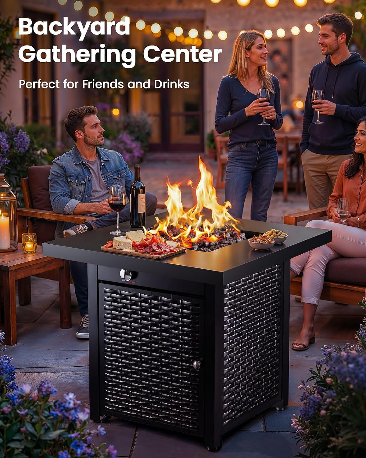 Black square propane fire pit table on a patio with people gathered around and flames rising from the center