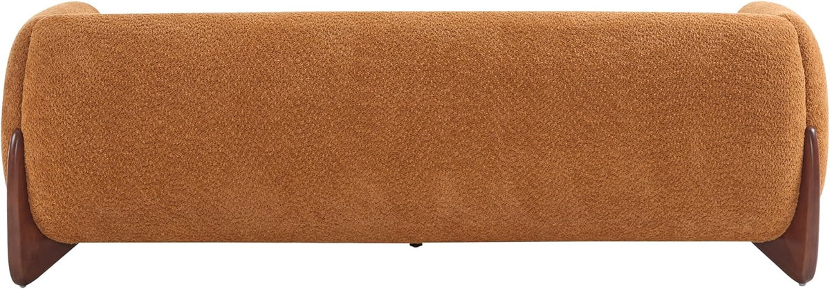 Low frontal view of the sofa's base showing textured caramel-brown upholstery and wooden feet.