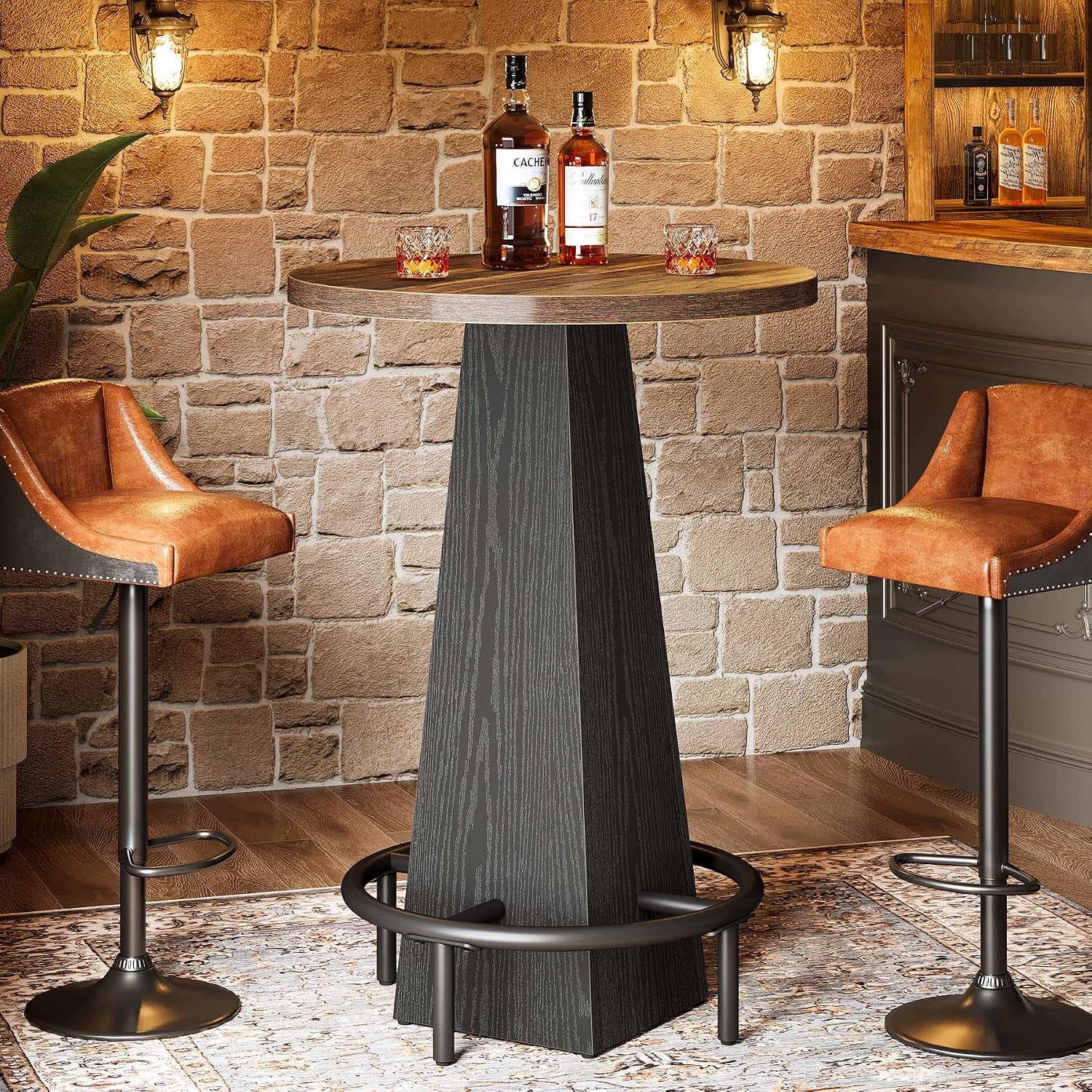 Close view of a round cocktail table with wood top, textured tapered base and metal ring footrest.