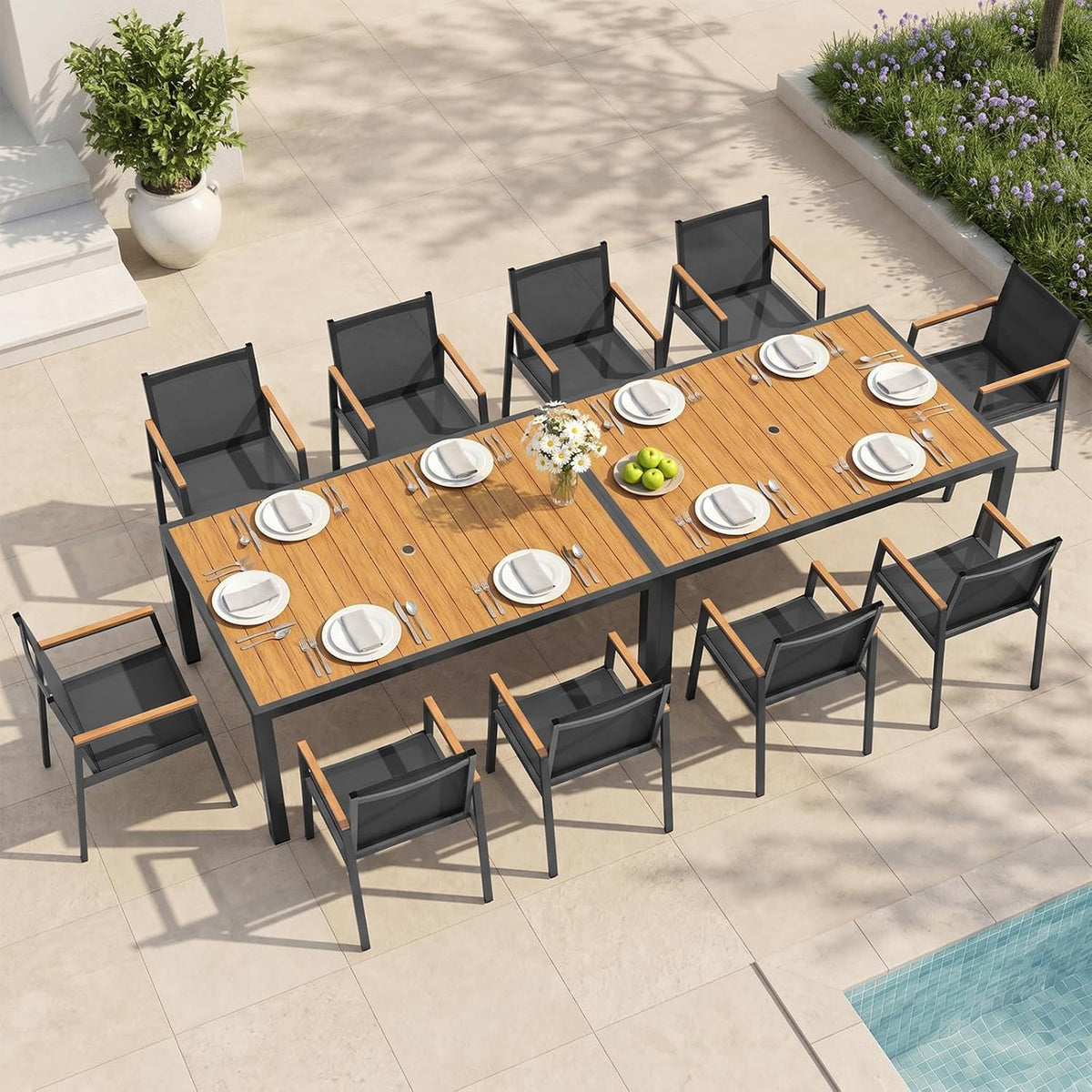 Large outdoor dining setup with two joined rectangular wood-top tables and ten chairs by a pool.