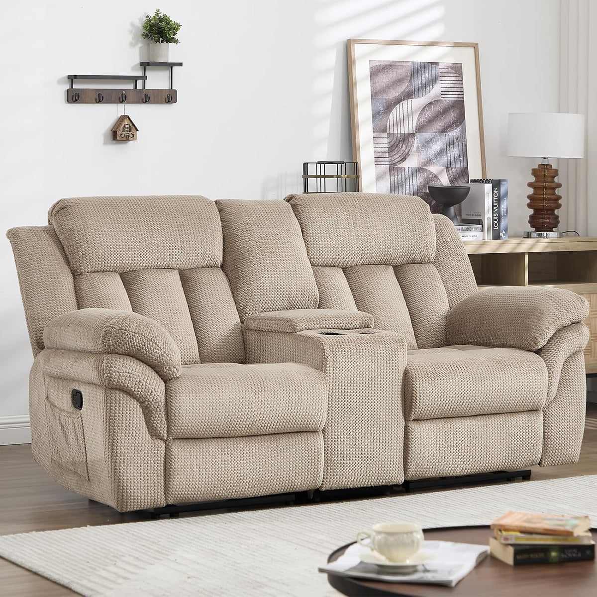Close-up of the light brown two-seat reclining loveseat with center console and padded arms.