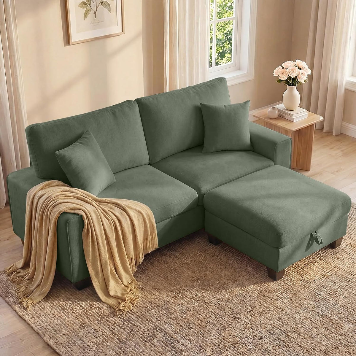 Green chenille loveseat with matching ottoman angled in a sunlit corner with a throw on the arm