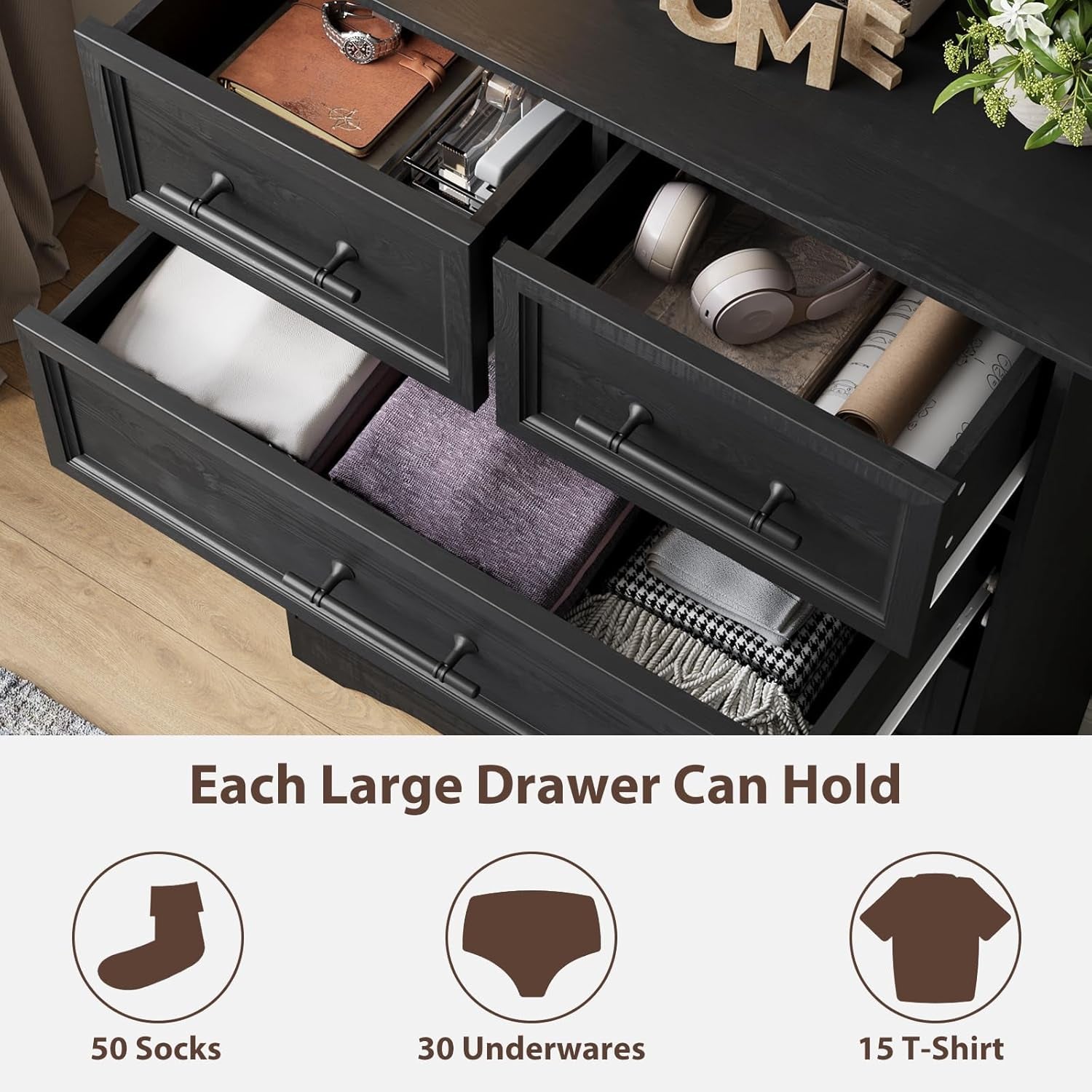 Top-down view of open drawers showing interior storage and folded linens