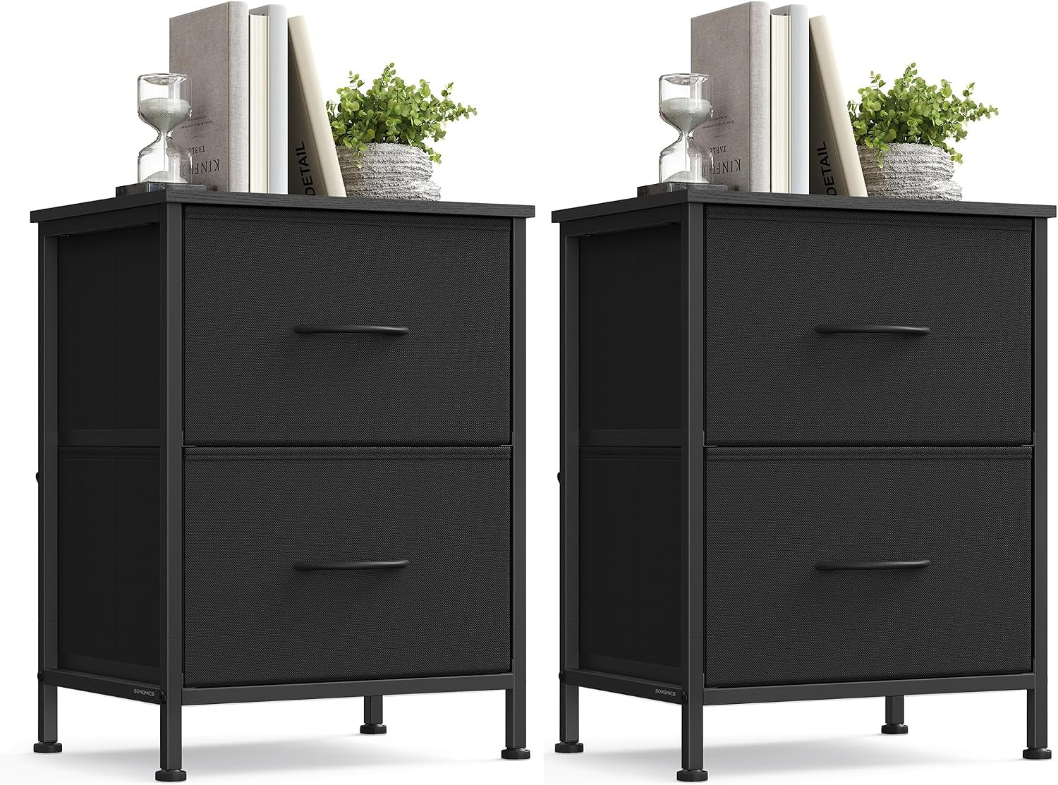 Two identical black bedside chests side by side with decorative items on top