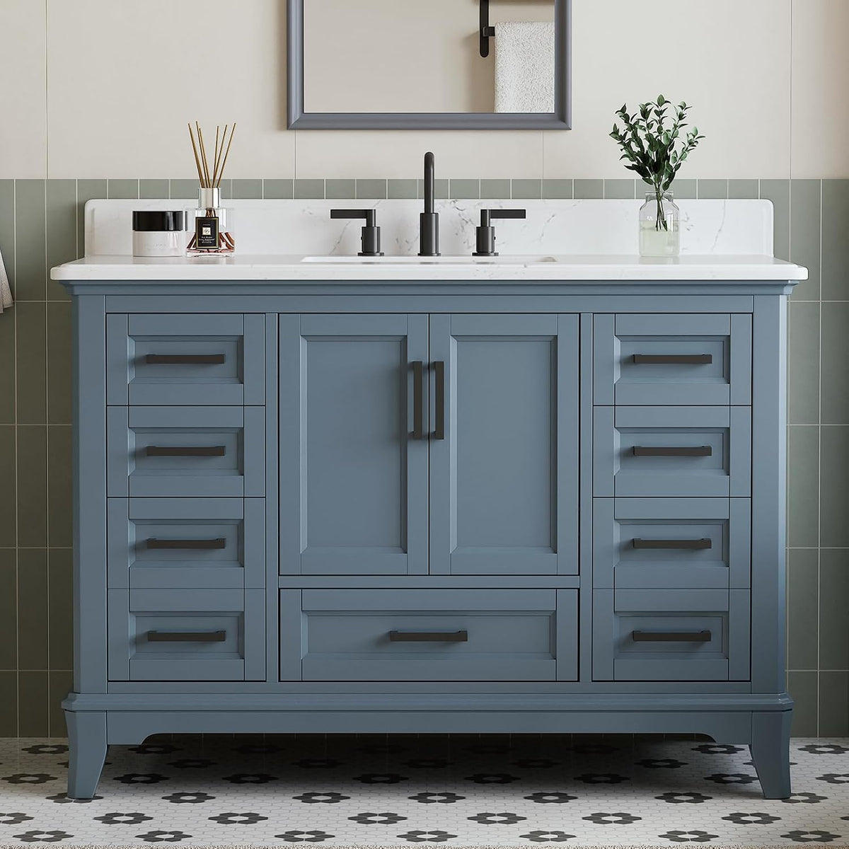 Front view of a steel-blue bathroom vanity with quartz top and black hardware