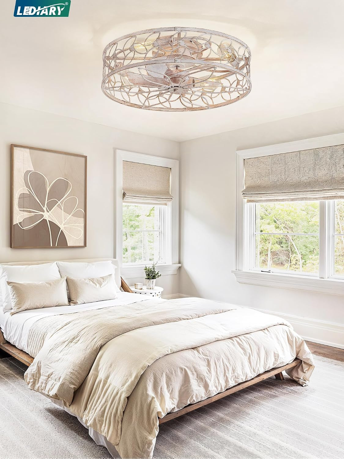 Bedroom scene with the decorative round caged ceiling fan mounted flush to the ceiling above the bed.