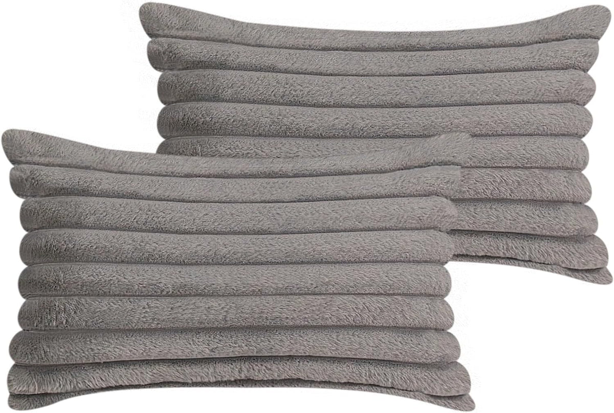Two stacked square faux-fur pillow covers in light gray with horizontal ribbed tubes