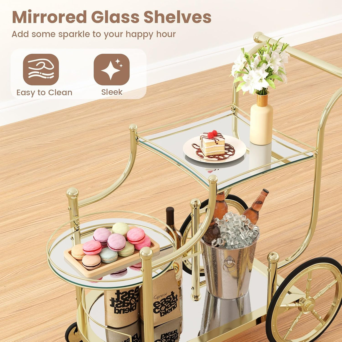 Close top view of gold bar cart showing the square mirrored top shelf and round mirrored middle shelf with desserts displayed