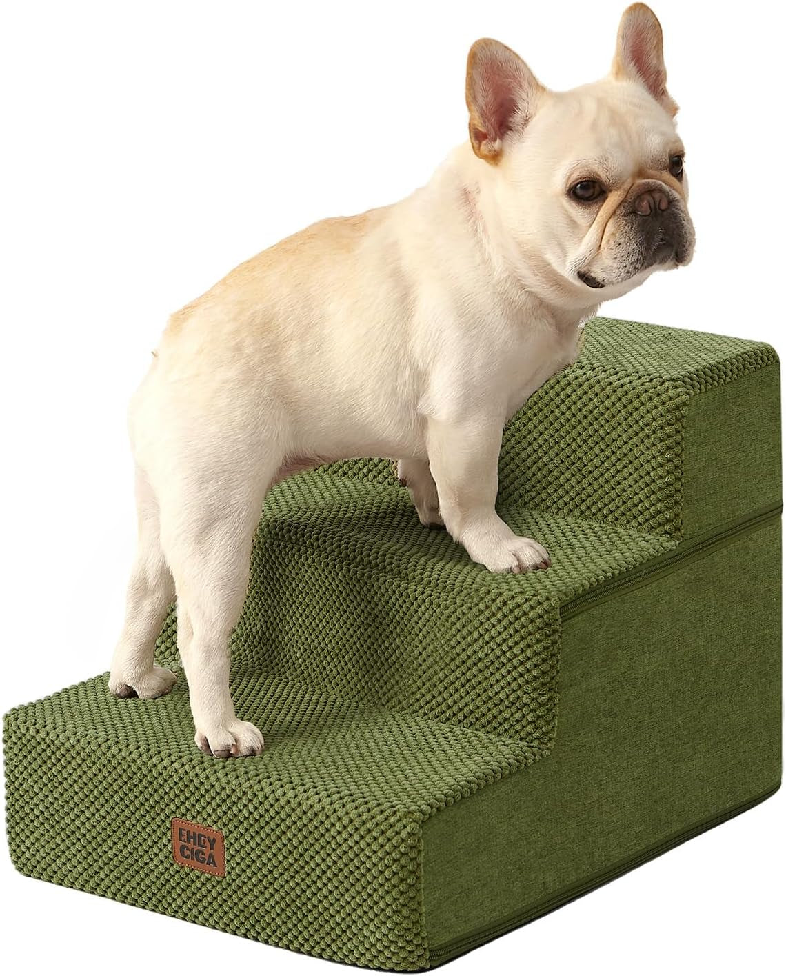 Light-colored French bulldog standing on olive-green four-step fabric pet stairs
