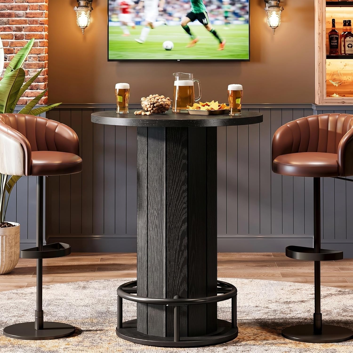 Same round bistro table in deep black finish, styled with beer glasses and snacks on top