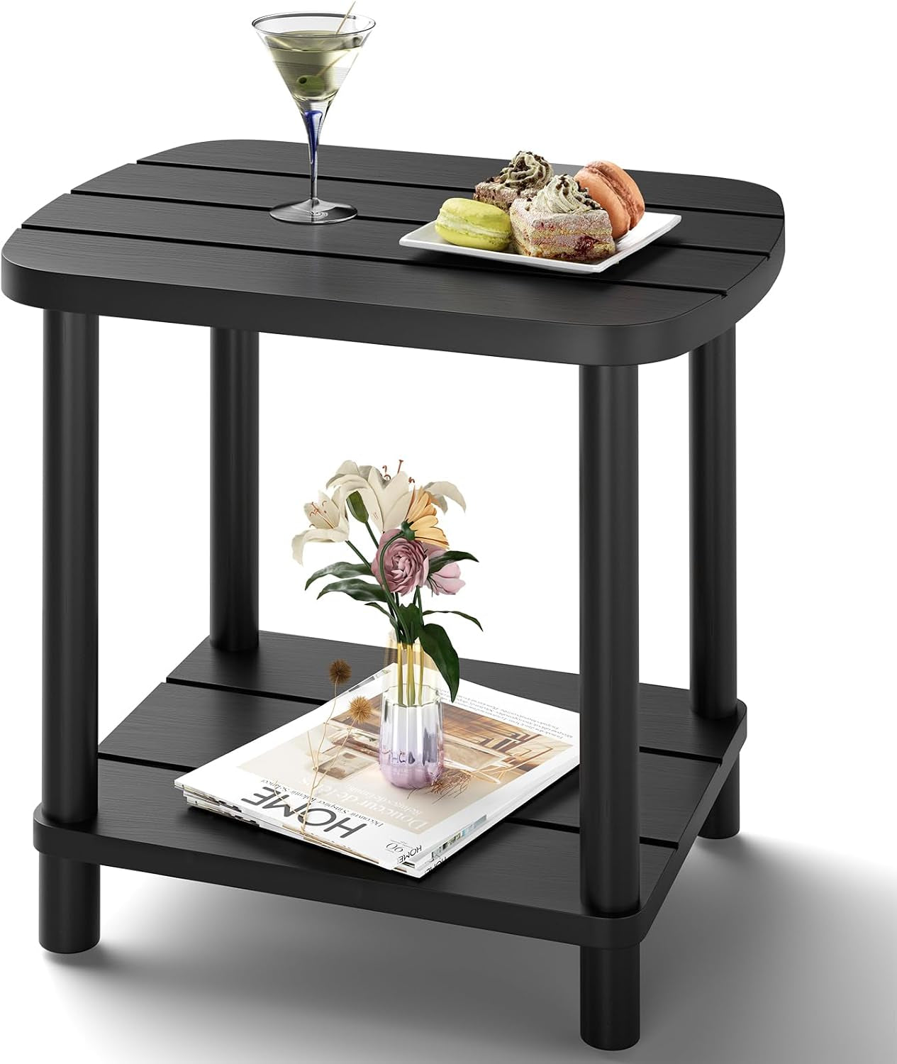 Studio shot of a small black two-tier slatted side table with rounded top and four round legs; lower shelf holds a magazine
