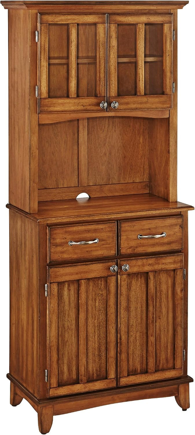 Cottage oak finish buffet server with a two-door glass hutch and two drawers, front view on white background