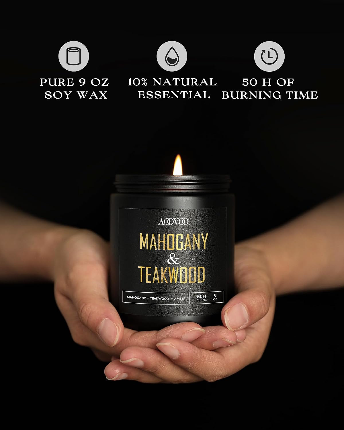 Hands presenting a single black jar candle labeled Mahogany & Teakwood against a dark background with burn-time icons above.