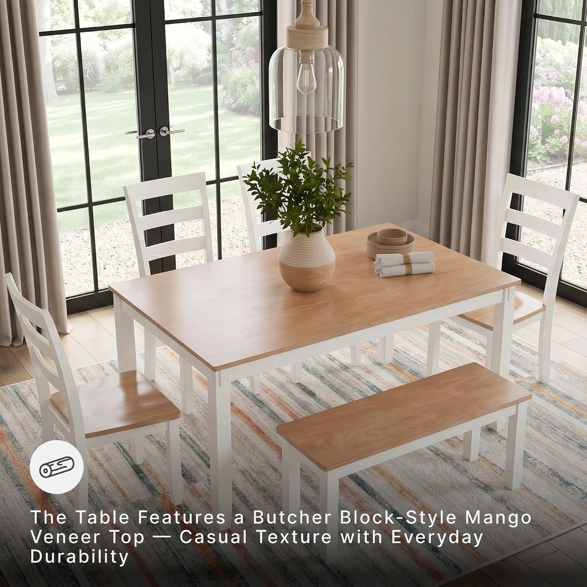 Corner view of the two-tone dining set on a patterned rug beneath a pendant light, showing table top and bench placement