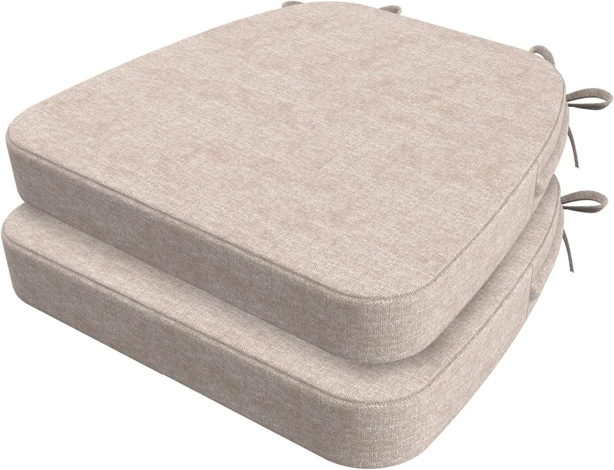 Two oatmeal beige D-shaped chair cushions stacked, showing rounded corners and tie loops