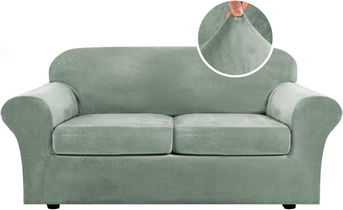 Front-facing two-seat sofa in sage green with rounded arms, low black feet visible and a circular close-up of the fabric at