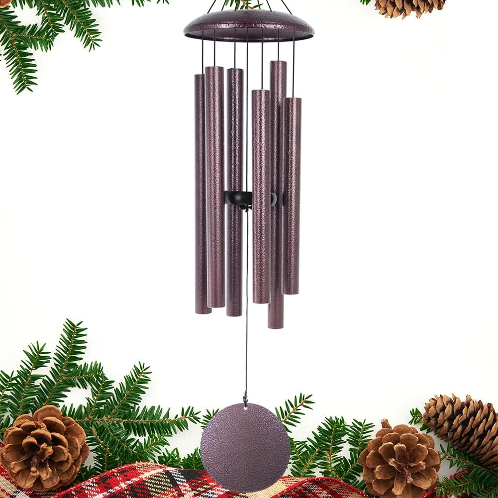 Studio shot of a purple-toned wind chime with six textured metal tubes and circular sail on white background.